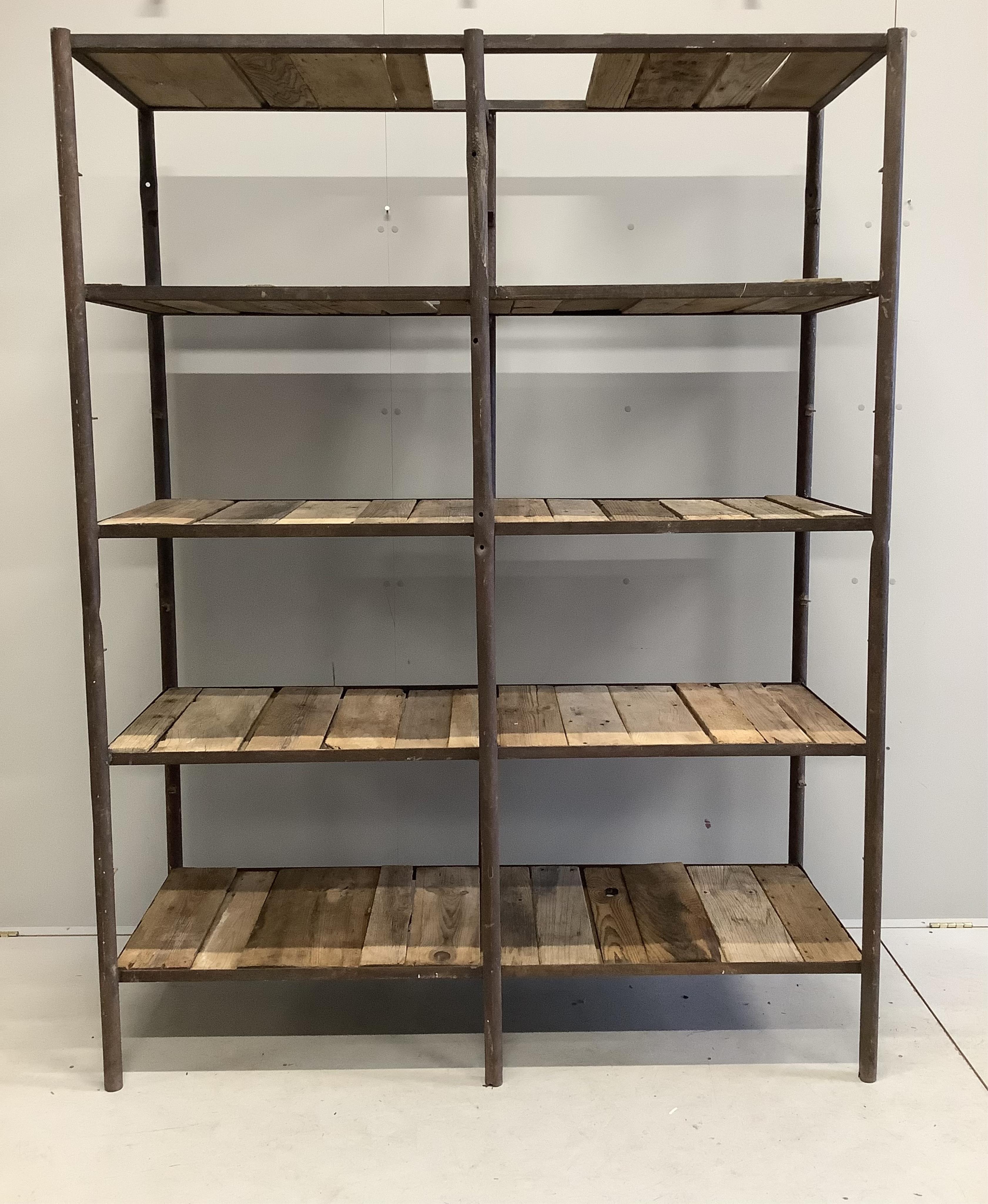 An industrial style wrought iron open shelf unit, width 154cm, depth 57cm, height 200cm. Condition - fair